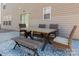A patio showcases an inviting outdoor dining area complete with table, chairs, and bench seating at 1017 Village Green Ln, Rock Hill, SC 29730