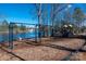 Community playground featuring swings and play structures by a serene lake at 1017 Village Green Ln, Rock Hill, SC 29730
