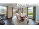 Dining area with a wooden table, six chairs, and a sliding glass door to the backyard at 1029 Merganser Way, Indian Trail, NC 28079