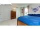 Bright bedroom featuring a Hornets theme, neutral carpet, and a large window at 1049 Merganser Way, Indian Trail, NC 28079