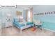 Bright bedroom featuring a playful color scheme, a cozy chair, and plush carpet at 1049 Merganser Way, Indian Trail, NC 28079