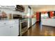 Modern kitchen with white cabinets, stainless steel appliances, and a view to the Dining Room at 1049 Merganser Way, Indian Trail, NC 28079