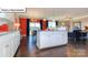 Open-concept kitchen with large center island, stainless steel appliances, and barstool seating at 1049 Merganser Way, Indian Trail, NC 28079