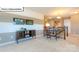 Upstairs loft area with entertainment center and desk space, bathed in natural light at 1049 Merganser Way, Indian Trail, NC 28079