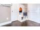Functional mudroom with built-in bench, storage cubbies, and convenient coat hooks near the garage entrance at 1049 Merganser Way, Indian Trail, NC 28079