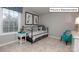 Bright bedroom with a comfortable bed, natural light, and cozy decor at 1051 Merganser Way, Indian Trail, NC 28079