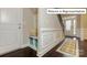 Welcoming entryway with storage cubbies, bench seating, wainscoting, and wood floors at 1051 Merganser Way, Indian Trail, NC 28079