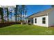 Spacious backyard featuring a patio with an outdoor kitchen, perfect for entertaining guests at 1055 Merganser Way, Indian Trail, NC 28079