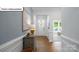 Bright entryway with hardwood floors and stylish decor leading into a naturally lit home at 1055 Merganser Way, Indian Trail, NC 28079