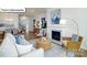 Bright open concept living room with modern decor and a cozy fireplace, adjacent to dining area at 1055 Merganser Way, Indian Trail, NC 28079
