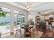 Open-concept dining area flows to the kitchen and living space with outdoor access at 1128 Avalon Pl, Matthews, NC 28104