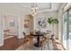 Cozy dining room features a round table and a stylish light fixture at 1128 Avalon Pl, Matthews, NC 28104