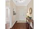 Elegant foyer boasts hardwood floors, chandelier, and decorative mirror at 1128 Avalon Pl, Matthews, NC 28104