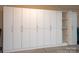 Garage includes white cabinets with decorative pulls for storage at 1128 Avalon Pl, Matthews, NC 28104