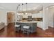 Beautiful kitchen features a large island with barstool seating and pendant lighting at 1128 Avalon Pl, Matthews, NC 28104