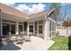 This lovely covered patio has concrete, table and chairs, screened porch, and overlooks a small decorative lawn at 1128 Avalon Pl, Matthews, NC 28104