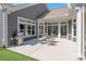 Outdoor patio features a grill and dining set for entertaining at 1128 Avalon Pl, Matthews, NC 28104