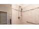 Tiled shower features an adjustable shower head and a built-in grab bar for accessibility at 1128 Avalon Pl, Matthews, NC 28104