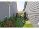 This side yard features artificial turf and a path to the back of the home at 1128 Avalon Pl, Matthews, NC 28104