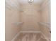Empty walk-in closet with wire shelving on all walls at 1128 Avalon Pl, Matthews, NC 28104