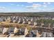 Aerial view showcasing a residential neighborhood with tree-lined streets and well-maintained homes at 141 Slip Shot Ln, Troutman, NC 28166