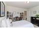 Bedroom with a comfortable bed, bedside table, dresser, and bookcase, creating a cozy and inviting atmosphere at 141 Slip Shot Ln, Troutman, NC 28166