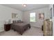 Bedroom featuring a bed, nightstands, and a window, creating a relaxing and inviting atmosphere at 141 Slip Shot Ln, Troutman, NC 28166