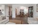 Open concept living and dining room with modern decor, lots of natural light, and hardwood floors at 141 Slip Shot Ln, Troutman, NC 28166