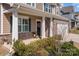 Charming front porch with stone accents and a decorative wreath on the front door at 141 Slip Shot Ln, Troutman, NC 28166