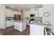 Bright kitchen features white cabinetry, granite countertops, stainless appliances, and a center island at 141 Slip Shot Ln, Troutman, NC 28166