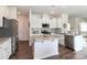 Spacious kitchen with a large island, stainless steel appliances, and modern finishes at 141 Slip Shot Ln, Troutman, NC 28166