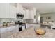 Bright kitchen featuring white cabinets, stainless steel appliances, and granite countertops at 141 Slip Shot Ln, Troutman, NC 28166