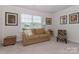 Comfortable living room with a sofa, chair, and large window offering a cozy and inviting atmosphere at 141 Slip Shot Ln, Troutman, NC 28166
