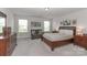 Spacious main bedroom with neutral paint, sitting area, plush carpet, and lots of natural light at 141 Slip Shot Ln, Troutman, NC 28166