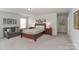 Spacious main bedroom with sitting area, neutral paint, and plush carpet at 141 Slip Shot Ln, Troutman, NC 28166