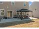 Back patio featuring a gazebo, outdoor seating, and a sliding glass door to the home's interior at 141 Slip Shot Ln, Troutman, NC 28166