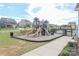 Community playground with slides and climbing structures, set in a well-maintained common area at 141 Slip Shot Ln, Troutman, NC 28166