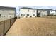 Expansive backyard with an iron fence, patio area, and views of the surrounding neighborhood at 14235 Canemeadow Dr # 102, Charlotte, NC 28278
