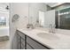 Bright bathroom featuring double sink vanity, quartz countertops, and modern fixtures at 14235 Canemeadow Dr # 102, Charlotte, NC 28278