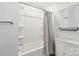 Bright bathroom with shower/tub, modern fixtures, and white vanity with cabinet at 14235 Canemeadow Dr # 102, Charlotte, NC 28278