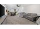 Spacious open-plan living area featuring neutral tones and a combination of seating and dining at 14235 Canemeadow Dr # 102, Charlotte, NC 28278