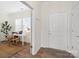 Welcoming foyer with a view of a bright home office, showcasing stylish flooring and a modern design at 14235 Canemeadow Dr, Charlotte, NC 28278