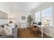 Bright and cozy home office featuring a neutral color palette, ample natural light, and comfortable furnishings at 14235 Canemeadow Dr, Charlotte, NC 28278