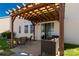 Backyard patio with a wooden pergola and cozy outdoor seating area at 1519 Arcadia Bluff Dr, York, SC 29745