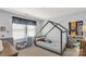 Bright bedroom with a charming house-frame bed, toy shelf, and chair at 1519 Arcadia Bluff Dr, York, SC 29745