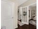 Open hallway with hardwood floors, decorative accents, and view into bedroom at 1519 Arcadia Bluff Dr, York, SC 29745