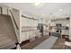 Bright kitchen with white cabinets, granite countertops, stainless steel appliances, and a center island with bar seating at 1519 Arcadia Bluff Dr, York, SC 29745