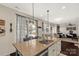 Kitchen island with granite countertops, stainless steel appliances, an eat-in area, and sliding doors to the backyard at 1519 Arcadia Bluff Dr, York, SC 29745