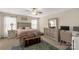 Relaxing primary bedroom with a ceiling fan, bedside tables, and a cozy bed at 1519 Arcadia Bluff Dr, York, SC 29745