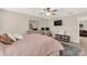 Spacious primary bedroom with a workspace, a TV, and a cozy bed setting at 1519 Arcadia Bluff Dr, York, SC 29745